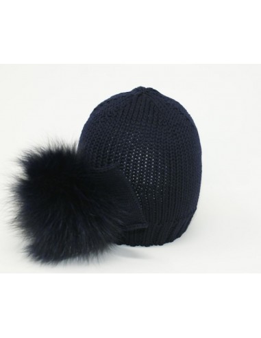 Hat in merino wool realized with wool bow and real fox pon pon attached on the side color blue